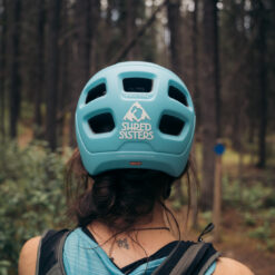Shred sisters sticker on the back of a helmet